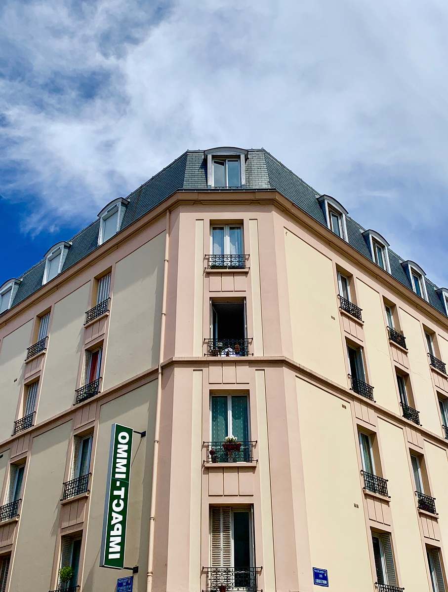 home decor white and green concrete building during daytime corner